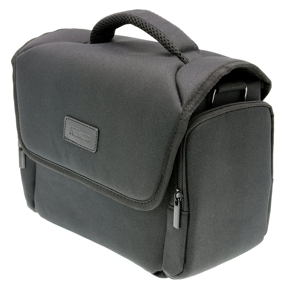 Black Nikon shoulder bag for camera, lenses, and accessories with padded interior.