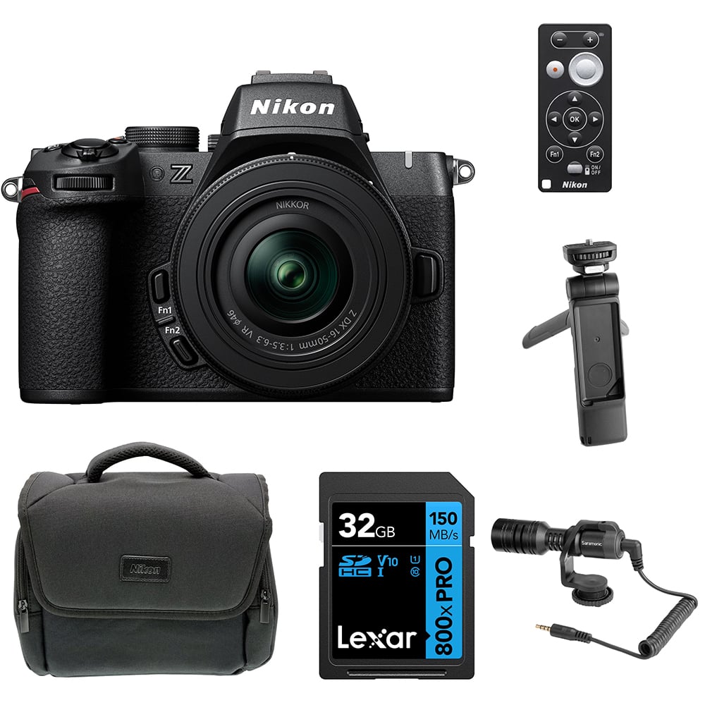 Nikon Z50 II Creator Kit in black featuring the Nikon Z50 II mirrorless camera body, mounted 16–50 mm and 50–250 mm zoom lenses, a 35 mm prime lens, and included accessories such as a vertical grip, LED light, and external microphone—all displayed together.