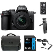 Nikon Z50 II Creator Kit in black featuring the Nikon Z50 II mirrorless camera body, mounted 16–50 mm and 50–250 mm zoom lenses, a 35 mm prime lens, and included accessories such as a vertical grip, LED light, and external microphone—all displayed together.