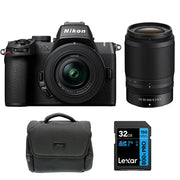 Nikon Z50 II mirrorless camera kit in black featuring two NIKKOR Z lenses (16–50 mm and 50–250 mm), with 3.2″ tilting touchscreen, built-in electronic viewfinder, and ergonomic textured grip.