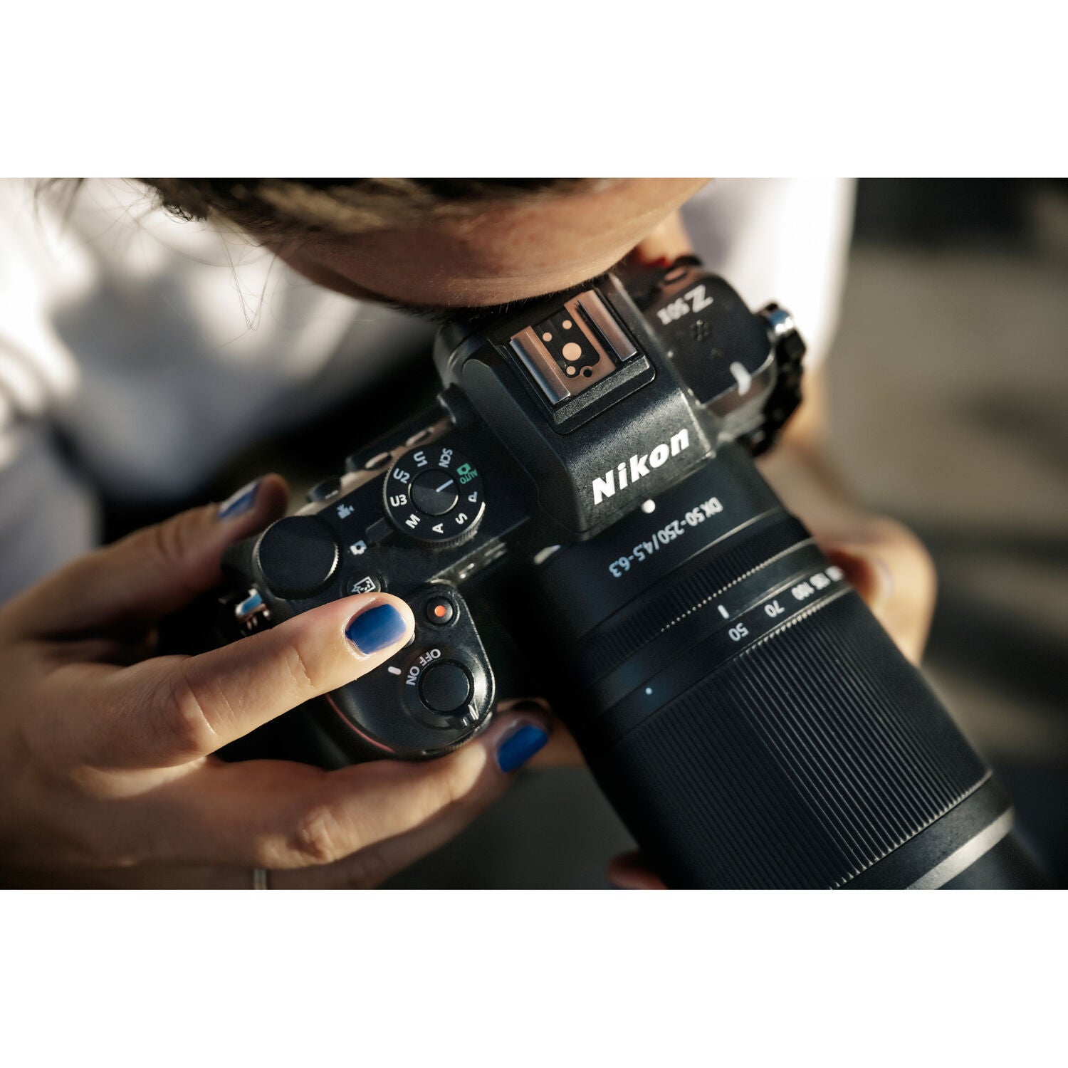 Nikon Z50 II mirrorless camera kit in black featuring two NIKKOR Z lenses (16–50 mm and 50–250 mm), with 3.2″ tilting touchscreen, built-in electronic viewfinder, and ergonomic textured grip.