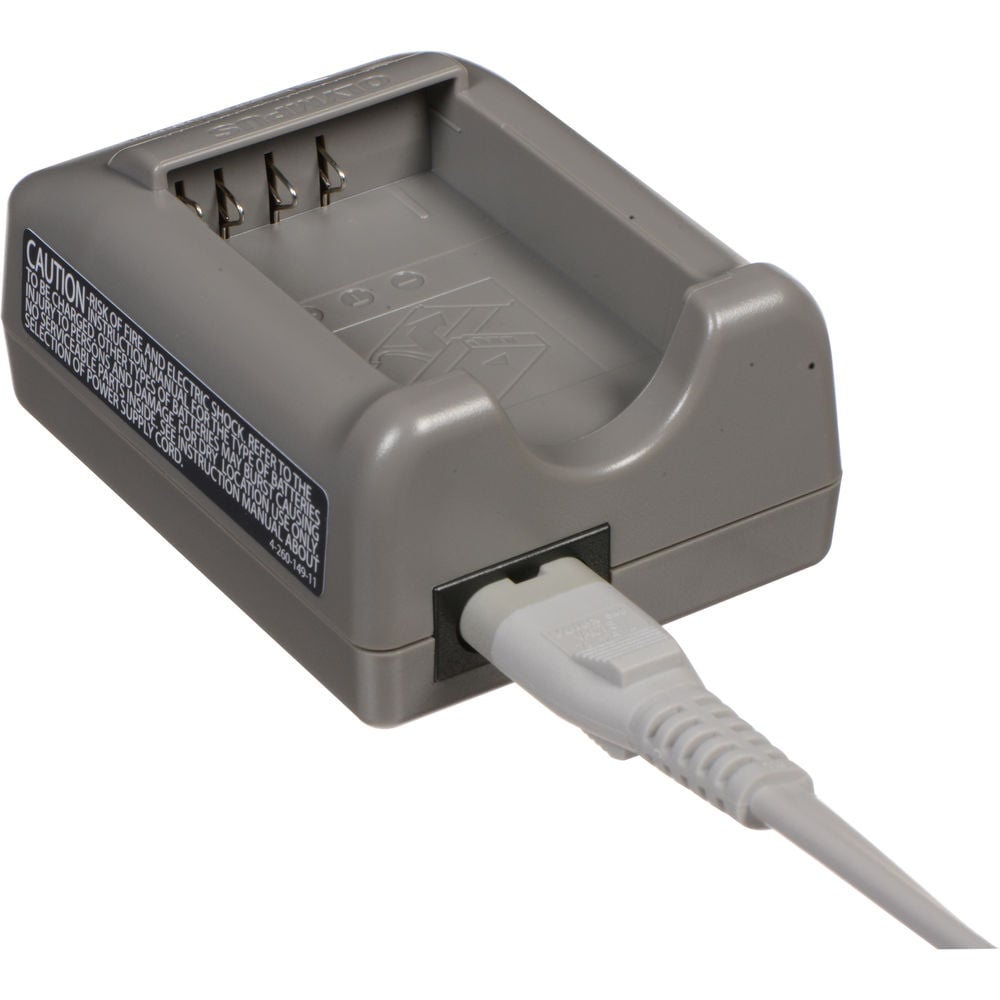 Olympus BCS-5 dedicated lithium-ion battery charger for BLS-5 and BLS-50 batteries, compatible with 100-240V AC international power supplies.