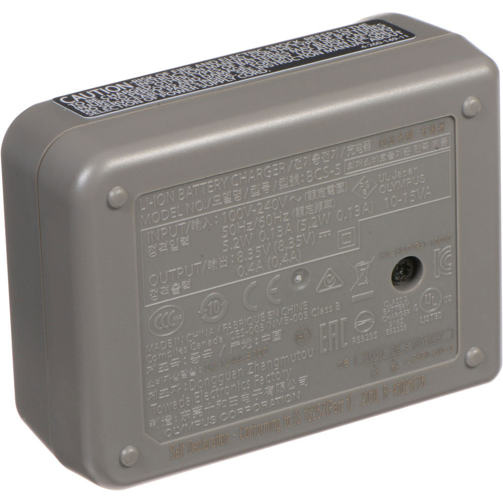 Olympus BCS-5 dedicated lithium-ion battery charger for BLS-5 and BLS-50 batteries, compatible with 100-240V AC international power supplies.