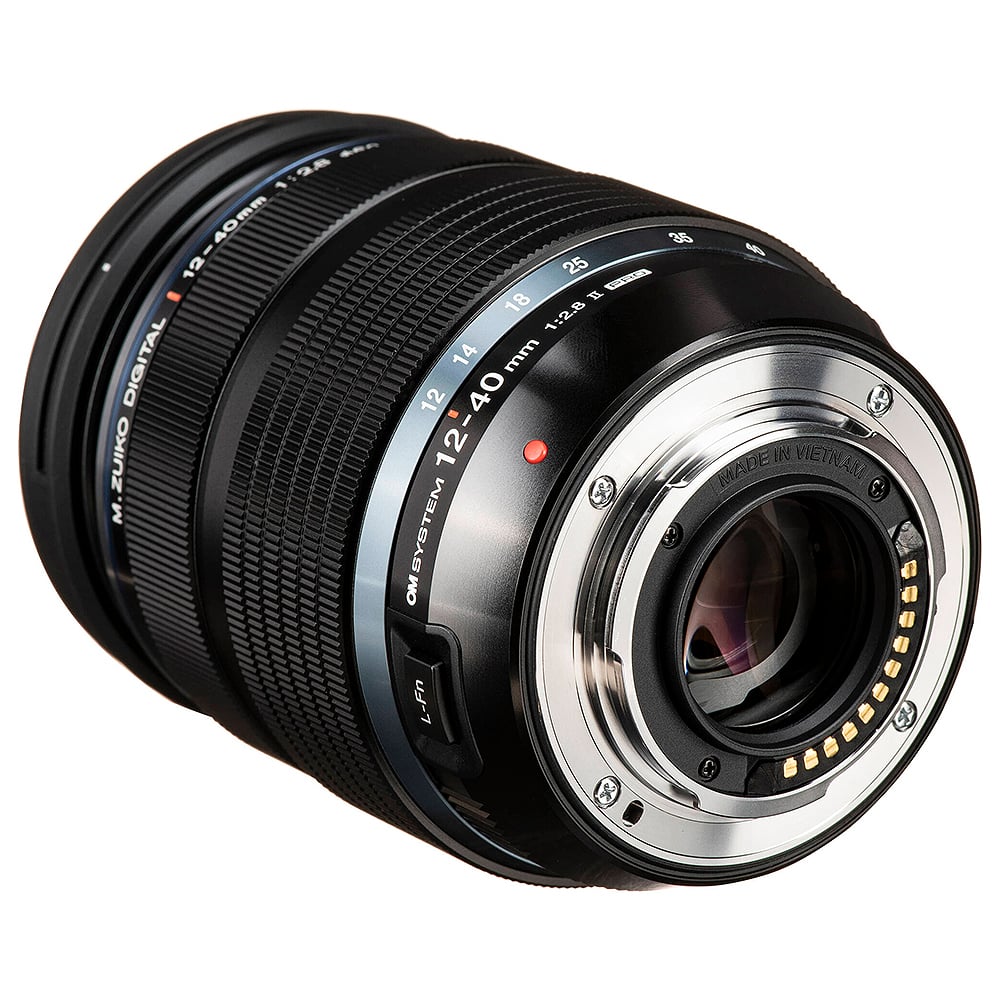OM System OM-1 Mark II mirrorless camera with 20MP stacked BSI Live MOS sensor, TruePic X processor, paired with versatile 12-40mm Pro II lens, 5-axis IBIS with 8.5 EV, 4K 60p video, and advanced AI autofocus.