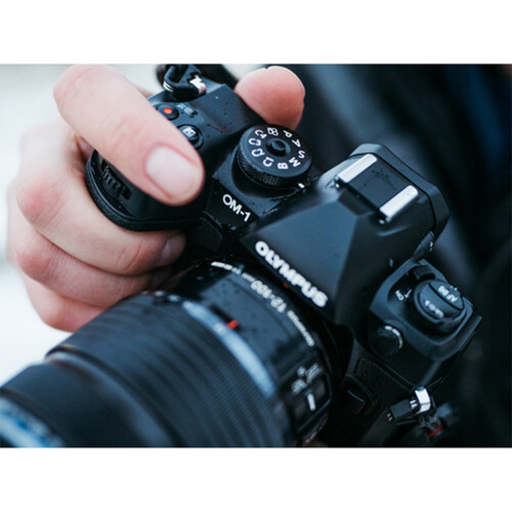 OM System OM-1 mirrorless camera with 20MP stacked BSI Live MOS sensor, TruePic X processor, 5-axis IBIS delivering up to 8 stops, 120fps EVF, 4K 60p video, and rugged IP53 weather-sealed body.