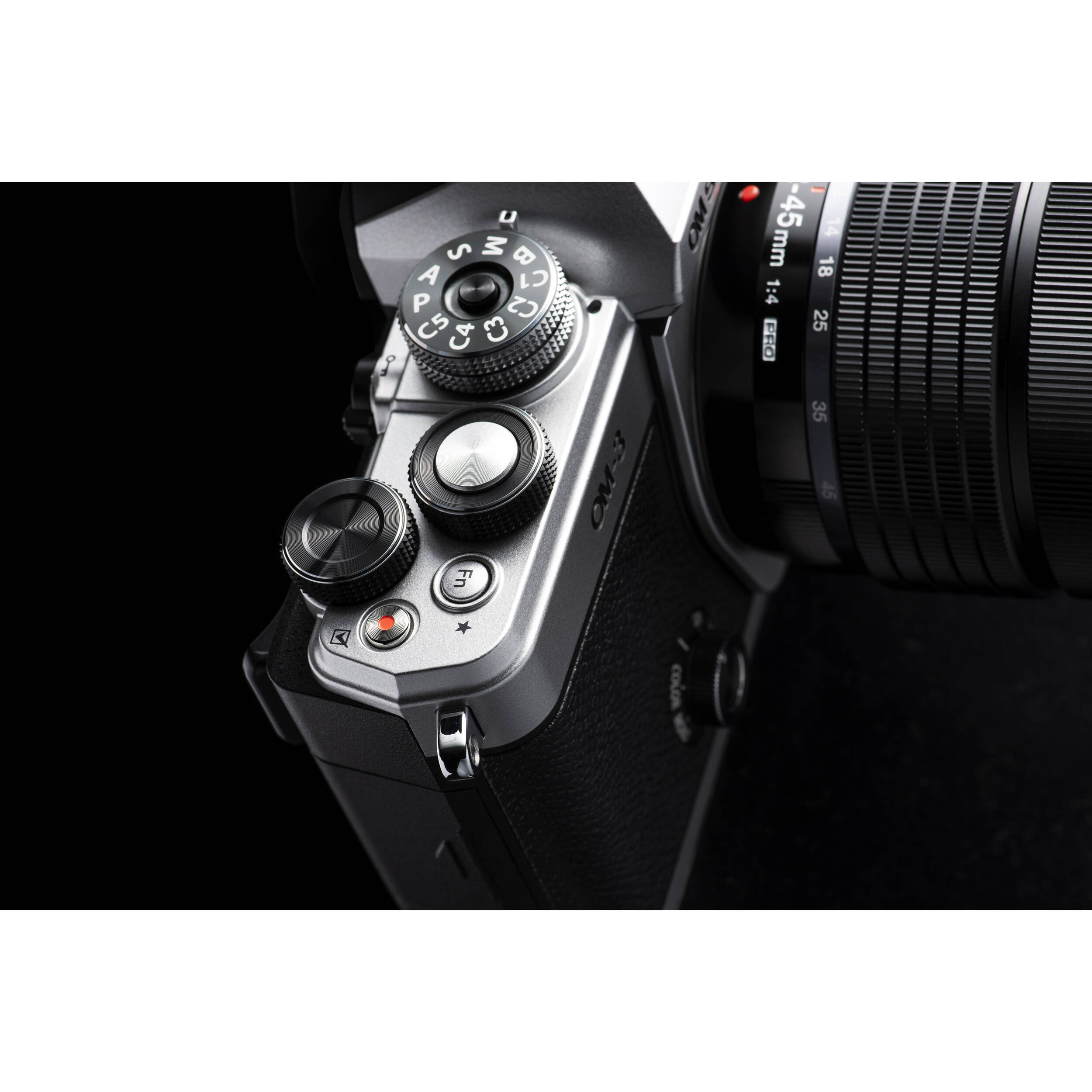 OM System OM-3 mirrorless camera with 20MP stacked BSI Live MOS sensor, TruePic X processor, 1053-point Quad Pixel AF covering 100% frame, up to 50 fps continuous AF burst, 4K 60p video, IP53 weather sealing, and 3-inch vari-angle touchscreen.