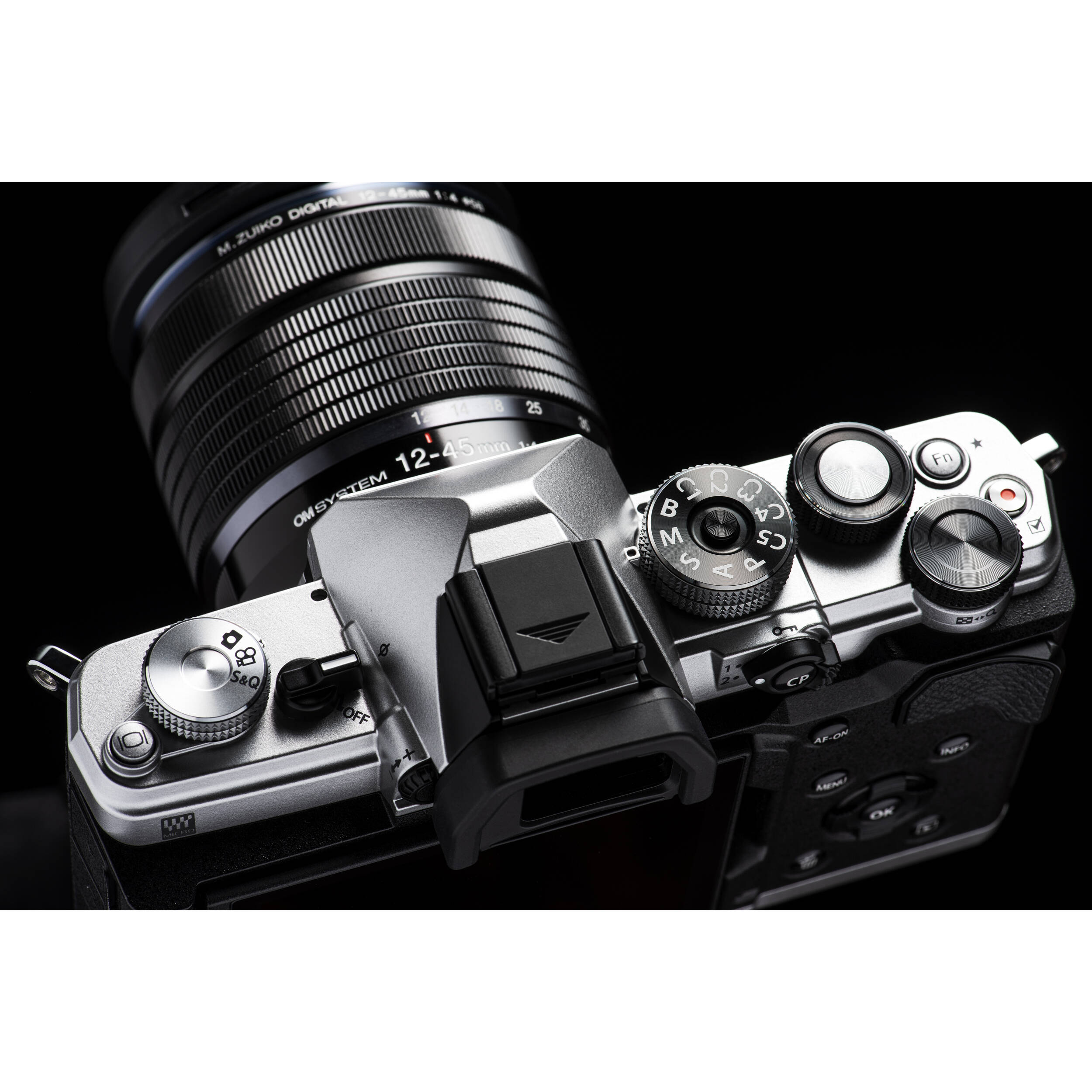 OM System OM-3 mirrorless camera with 20MP stacked BSI Live MOS sensor, TruePic X processor, 1053-point Quad Pixel AF covering 100% frame, up to 50 fps continuous AF burst, 4K 60p video, IP53 weather sealing, and 3-inch vari-angle touchscreen.