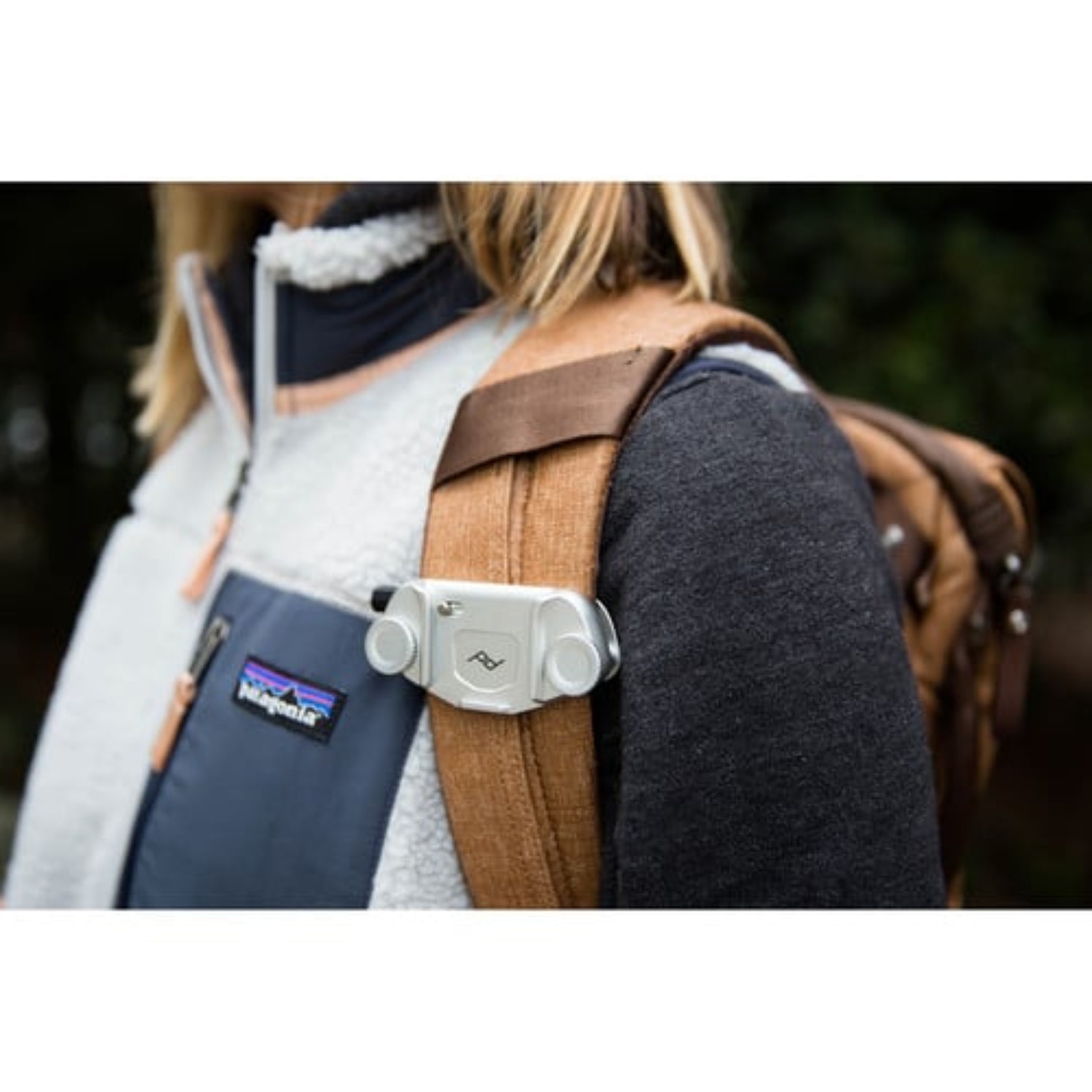 The Peak Design Capture Camera Clip V3 is a convenient way to carry our camera. It is composed of 2 parts, a metal clip that clamps onto any backpack or belt strap and the Arca tripod compatible plate that screws onto the bottom of your camera that provides you with instant access to your camera.