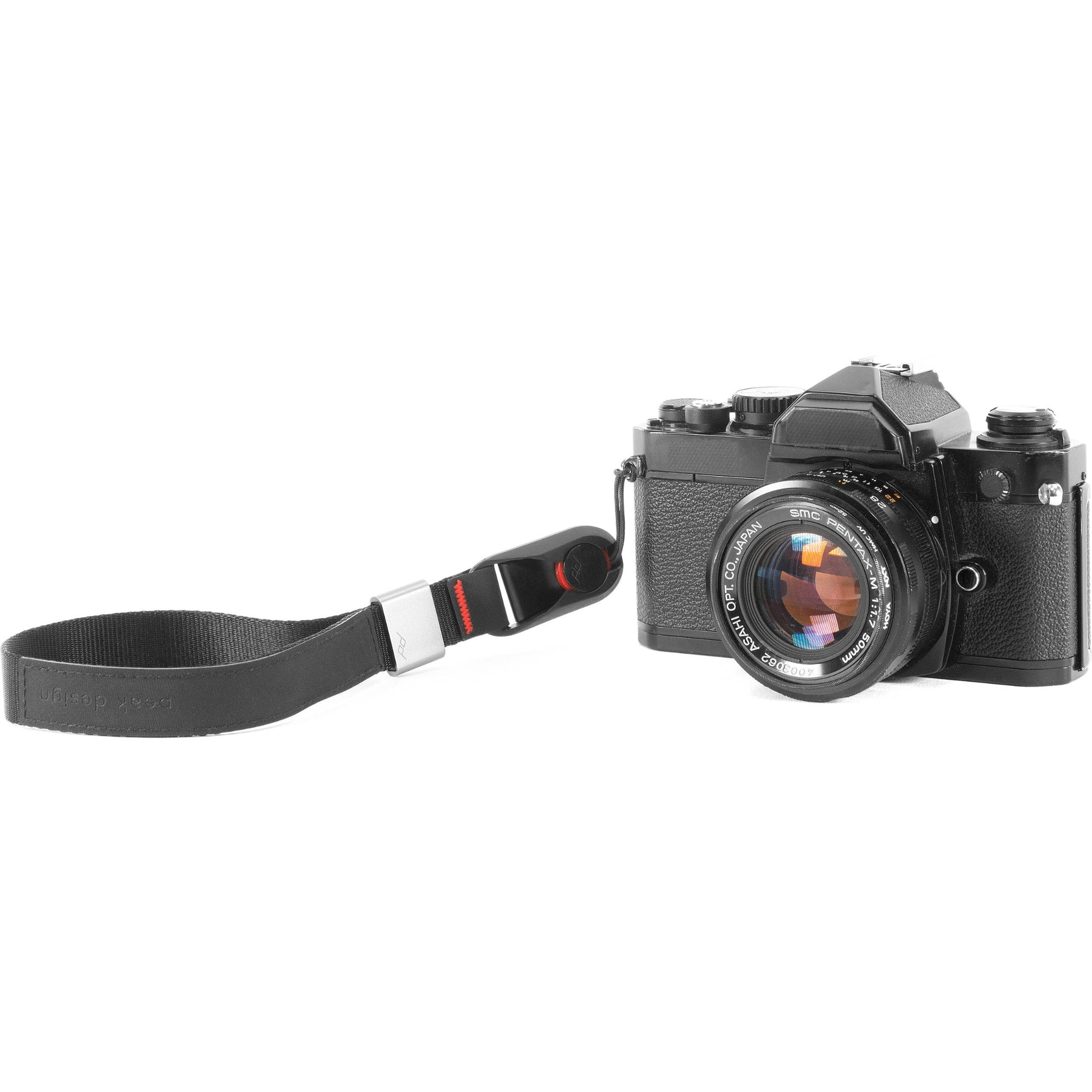 The wrist strap conveniently secures your camera or a pair of binoculars to an adjustable wrist strap.