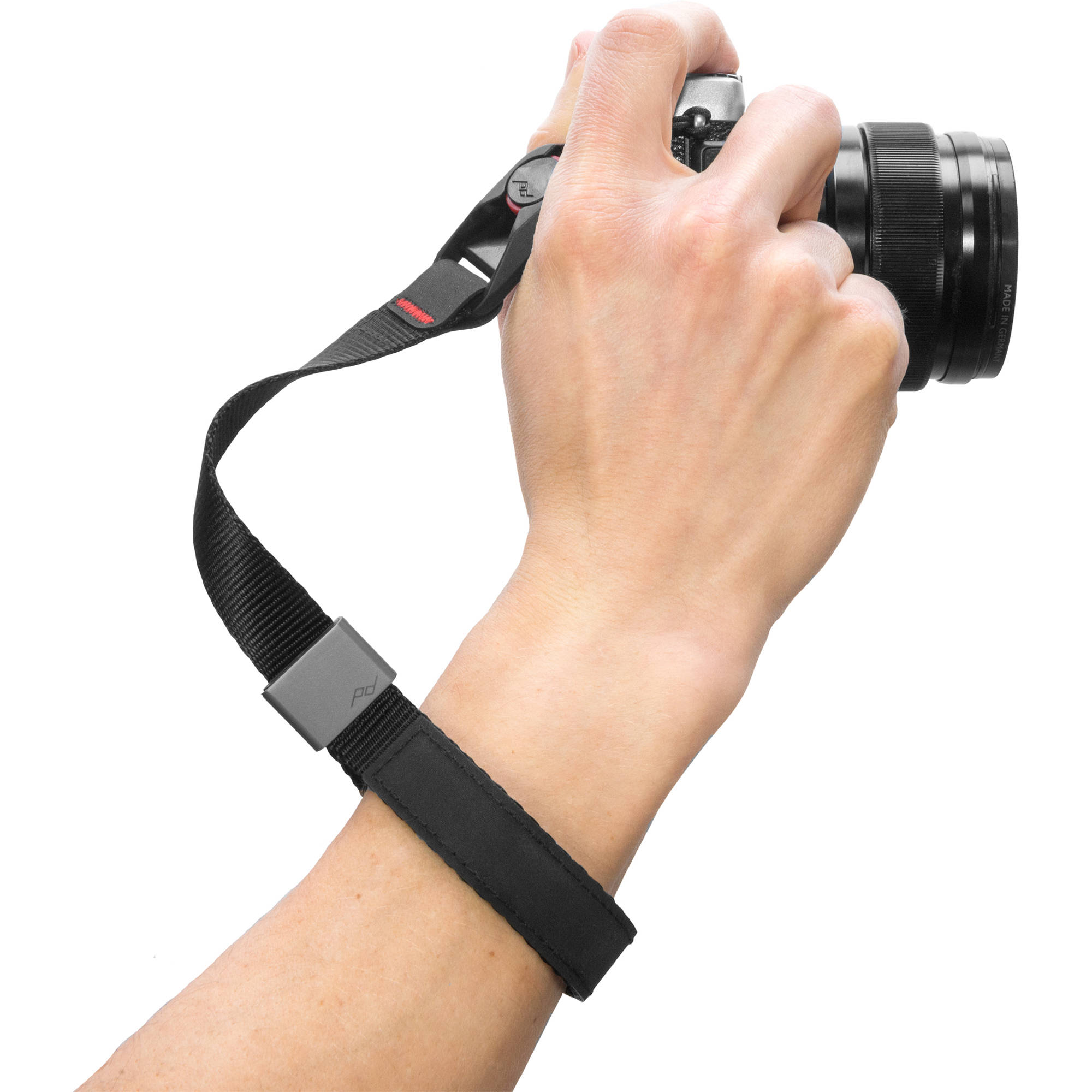 The wrist strap conveniently secures your camera or a pair of binoculars to an adjustable wrist strap.