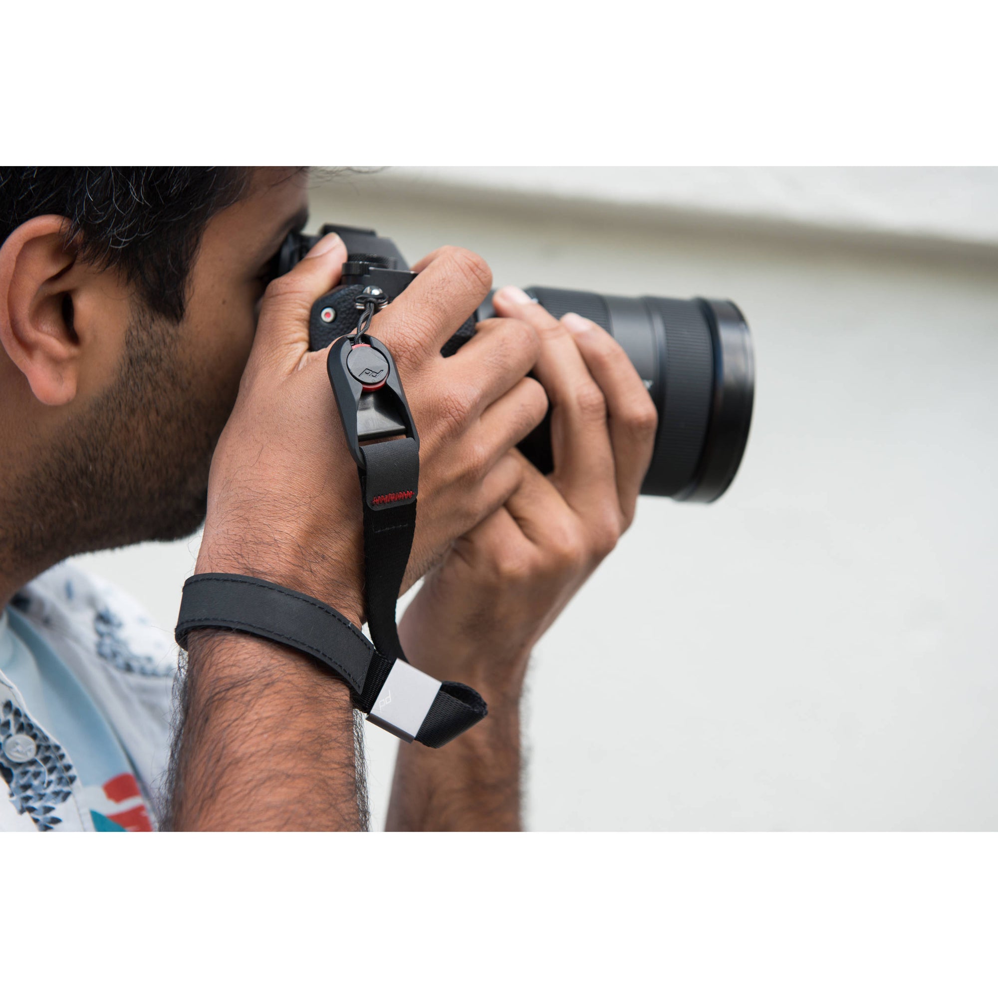 The wrist strap conveniently secures your camera or a pair of binoculars to an adjustable wrist strap.