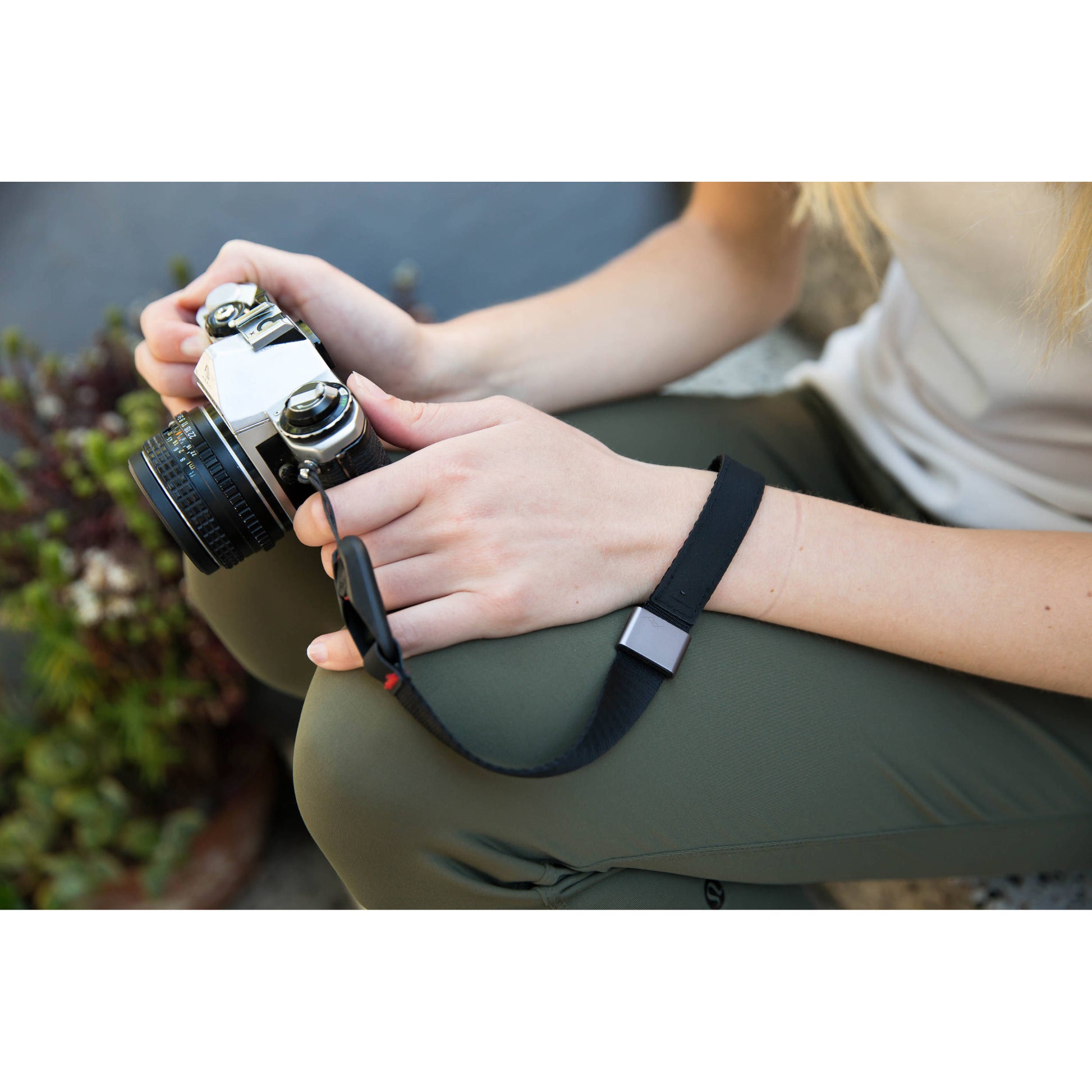 The wrist strap conveniently secures your camera or a pair of binoculars to an adjustable wrist strap.