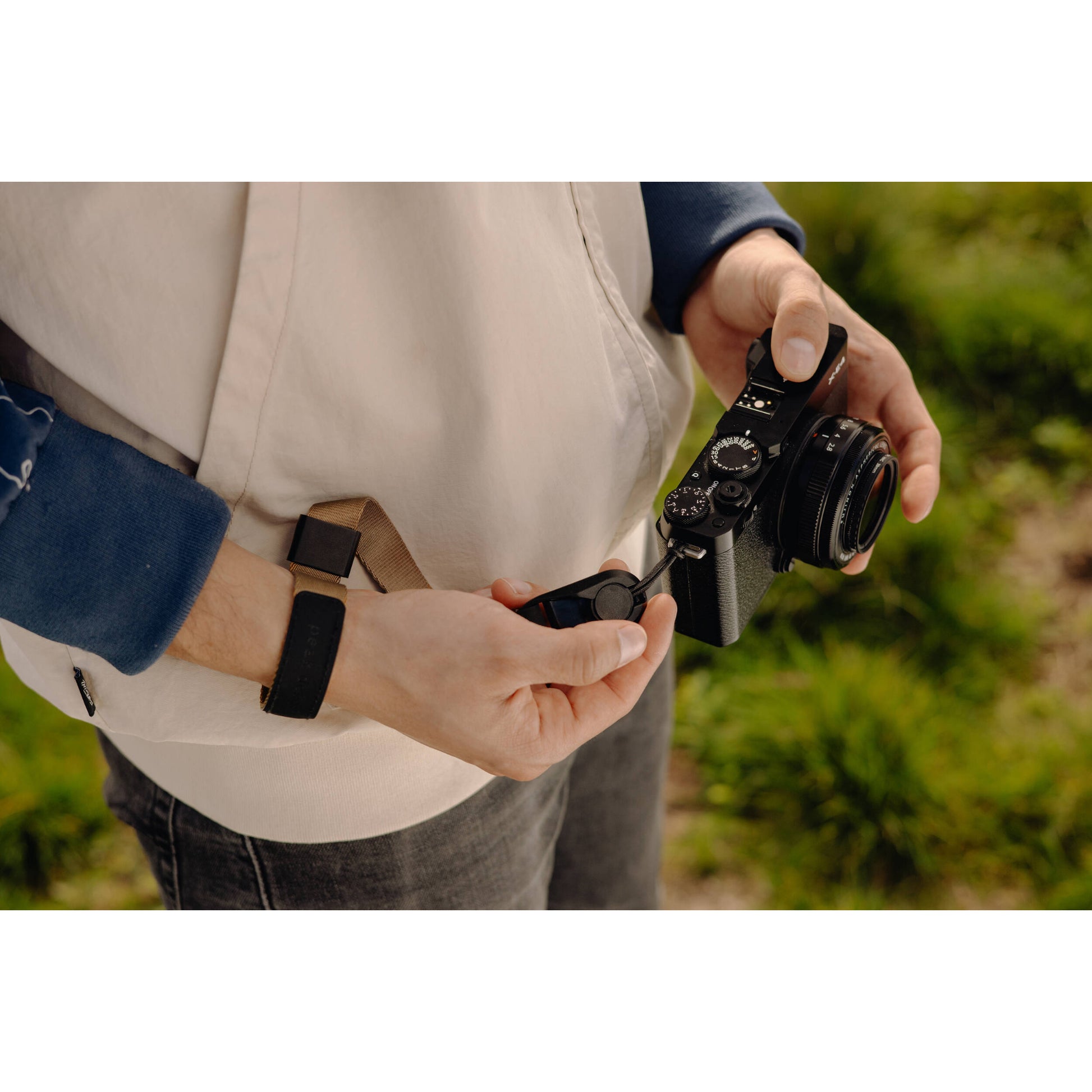 The Peak Design Cuff is a sleek, ultra-secure wrist strap with Dyneema-corded Anchors, holding over 90kg, perfect for protecting heavy cameras.