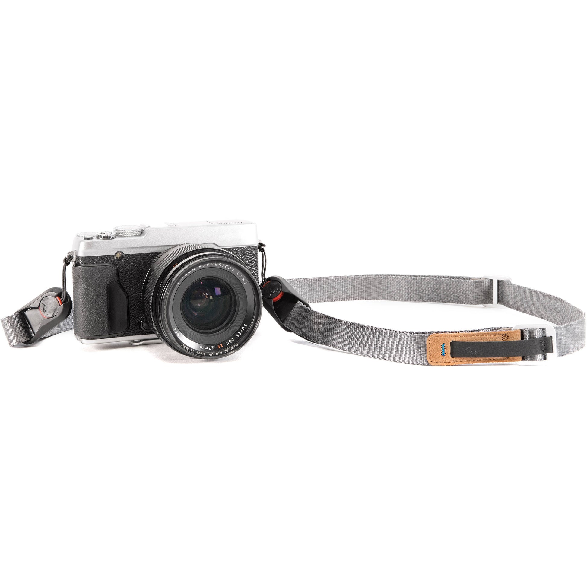 Peak Design Leash camera strap in Ash color, adjustable length from 83 to 145 cm, slim nylon webbing with leather accents, quick-adjust aluminum sliders, quick-release anchors rated for 90 kg, versatile for neck, shoulder, or cross-body carry.