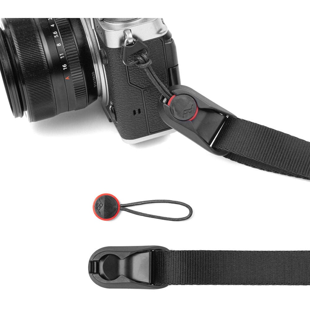 Peak Design Leash ultralight black camera strap, adjustable 83-145 cm, strong nylon webbing, quick-connect anchors rated for 90kg, versatile as sling, neck strap, safety tether, or video stabilizer.