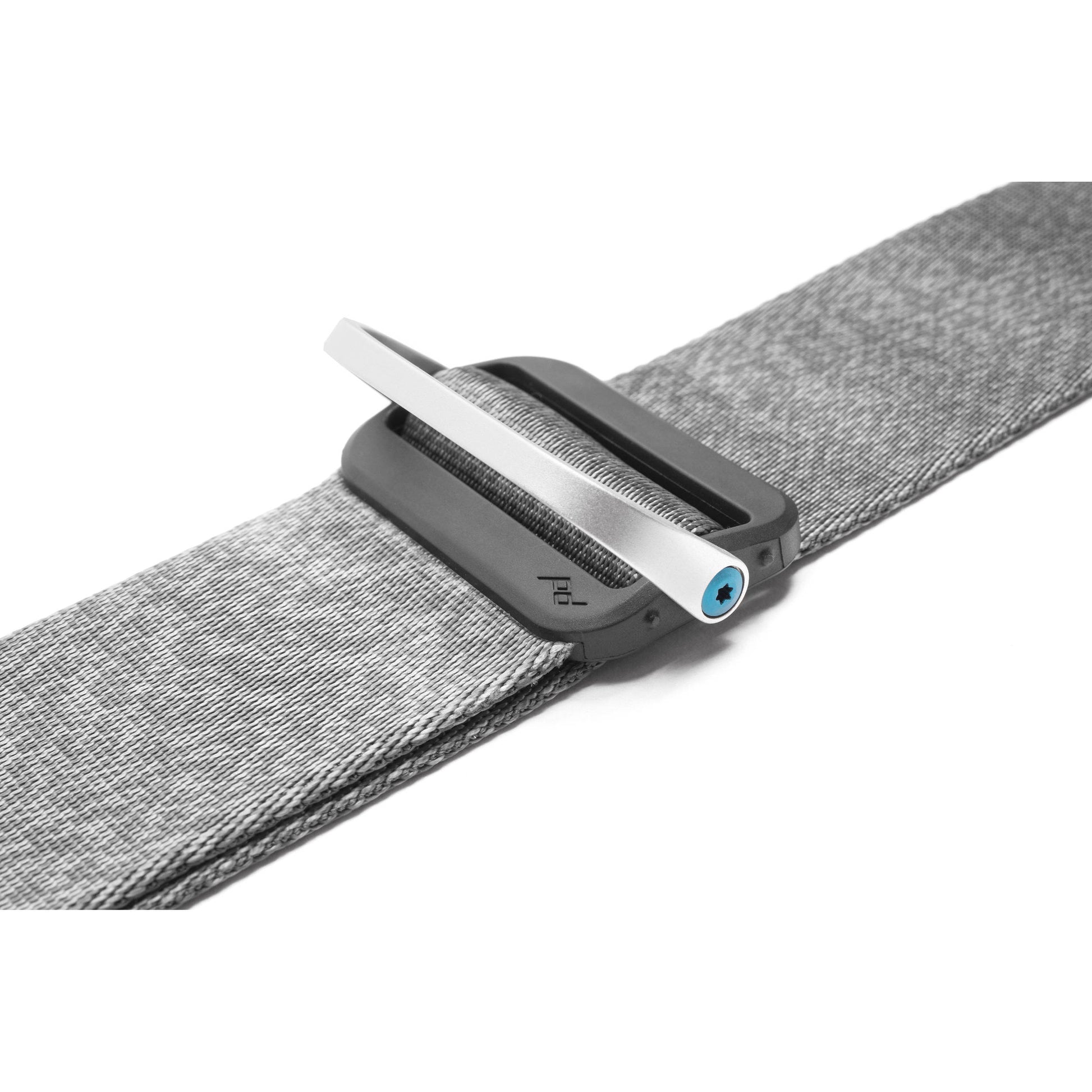 Peak Design Slide camera strap in Ash color, adjustable length 99-145 cm, 4.6 cm wide padded nylon webbing with smooth and grippy reversible sides, quick-connect Anchor Link system, supports up to 90 kg, usable as sling, neck, or shoulder strap.