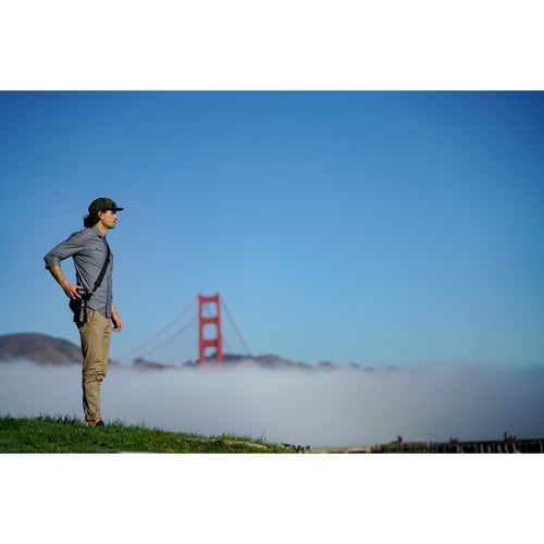 Peak Design Slide camera strap in black, versatile 3-in-1 sling, shoulder, or neck strap with quick-connect Anchor Link system, adjustable length 99-145 cm, padded 4.6 cm nylon webbing with smooth and grippy reversible sides, supports up to 90 kg.