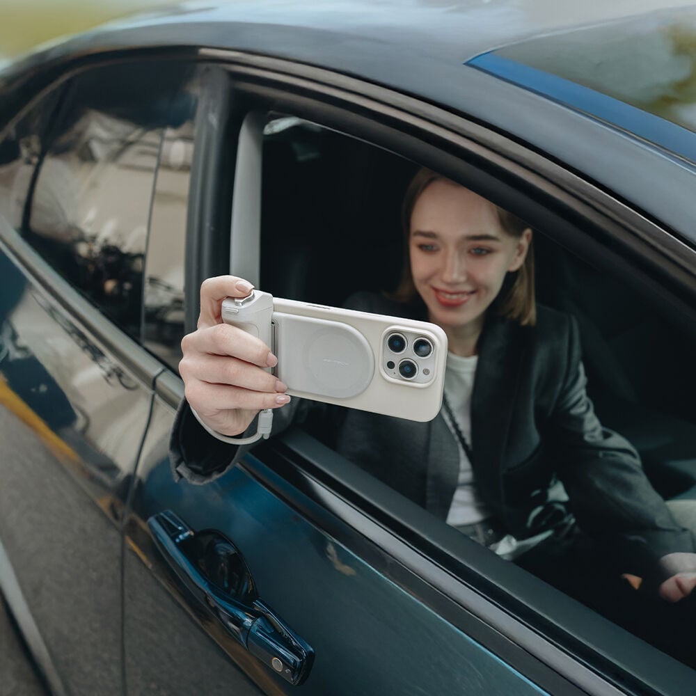 PGYTECH MagCam Phone Grip in grey with modular design including wireless charging, Bluetooth remote, ergonomic camera grip, and 3000mAh power bank.