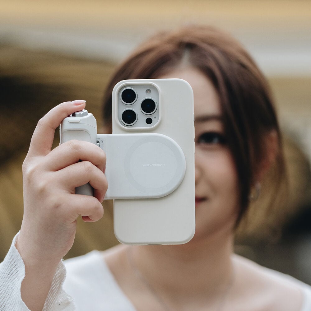PGYTECH MagCam Phone Grip in grey with modular design including wireless charging, Bluetooth remote, ergonomic camera grip, and 3000mAh power bank.