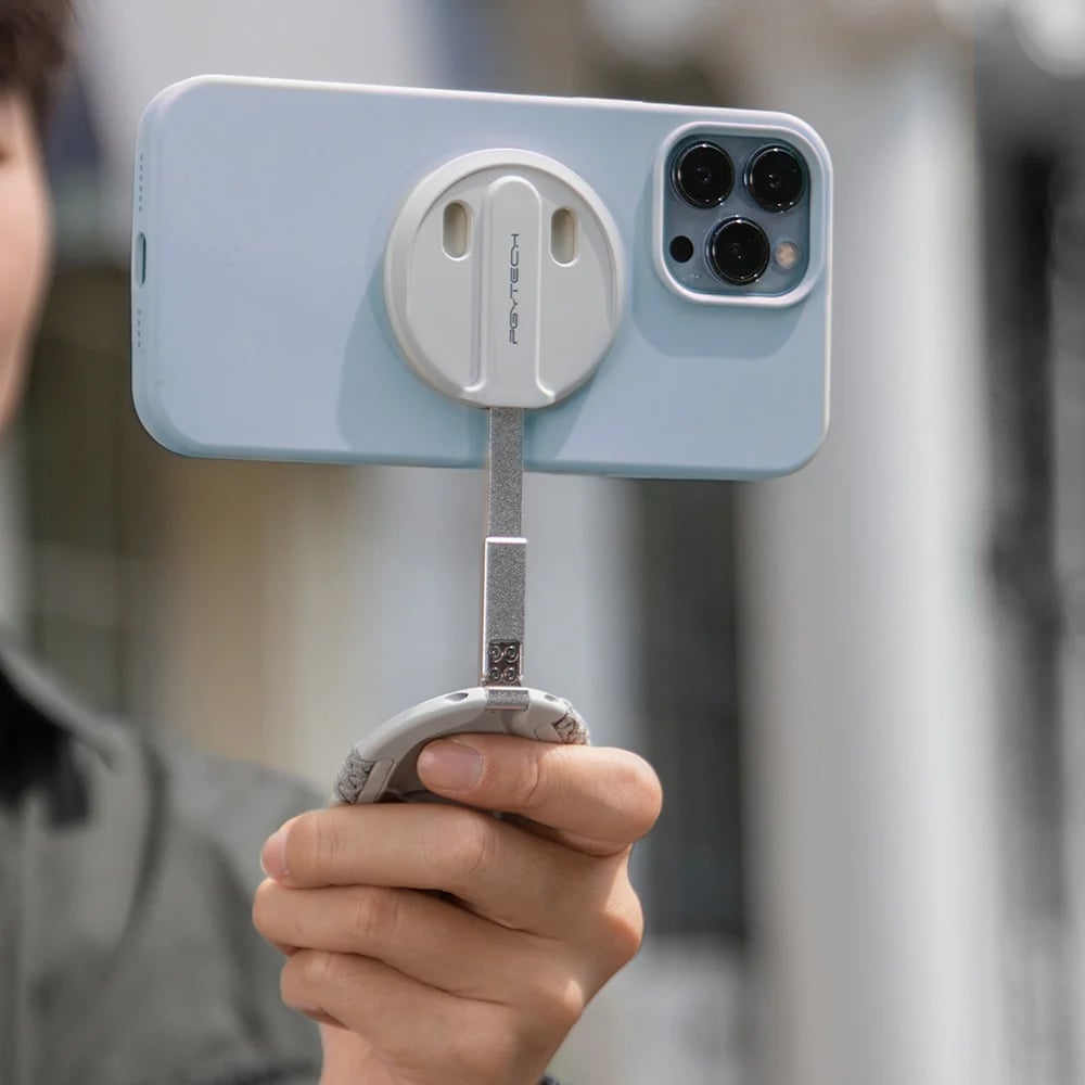 PGYTECH MagFlex Phone Photography Stand in grey with 6.1mm slim design, strong magnetic ring compatible with MagSafe, infinite rotating shaft, and extendable handle for versatile phone positioning.