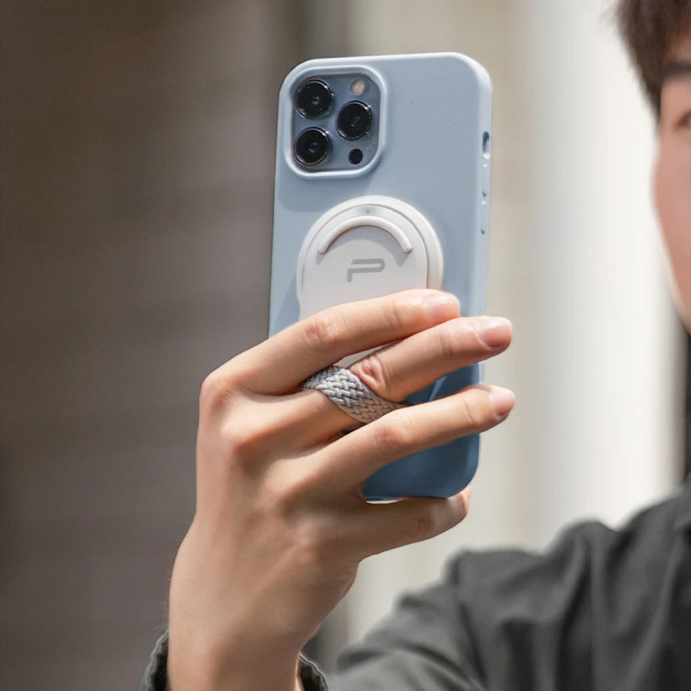 PGYTECH MagFlex Phone Photography Stand in grey with 6.1mm slim design, strong magnetic ring compatible with MagSafe, infinite rotating shaft, and extendable handle for versatile phone positioning.