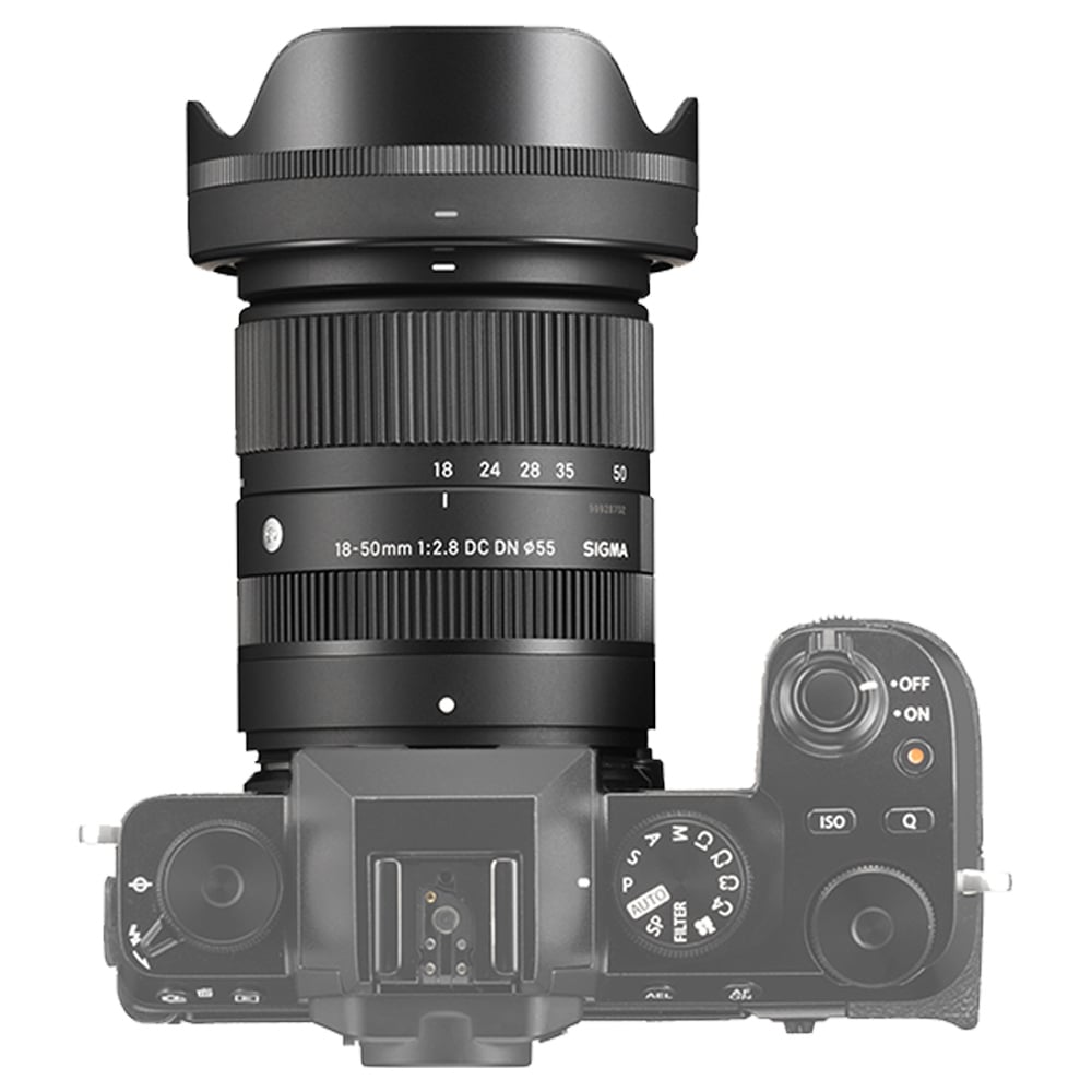 Camera lens with Sigma branding on a white background