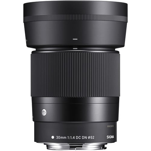 Black camera lens with visible brand name on a white background