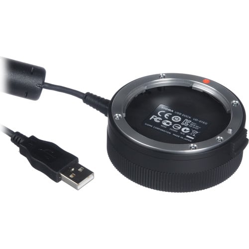 Circular USB device with a cable on a white background