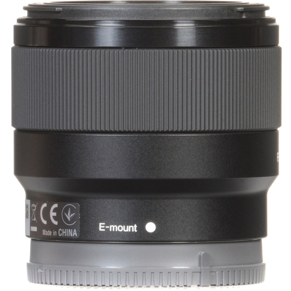 Camera lens with E-mount marking on a white background