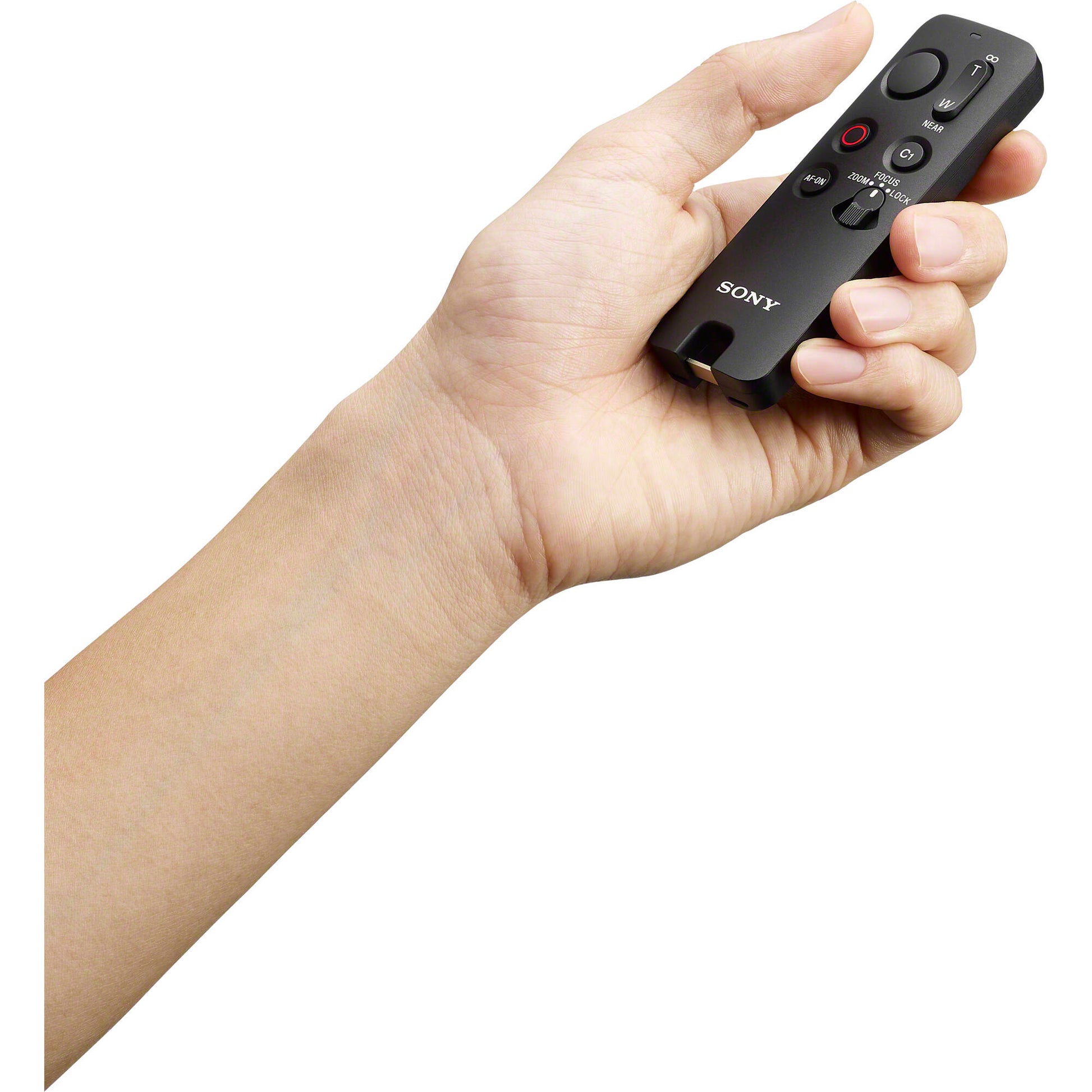 Sony RMT-VP2 wireless remote commander with Bluetooth connectivity, 10m operating range, one-handed control buttons for shutter, movie recording, autofocus, customizable C1 button, zoom/focus rocker, LED status indicator, dust and moisture resistant design, compatible with Sony Alpha cameras and selected Xperia smartphones.