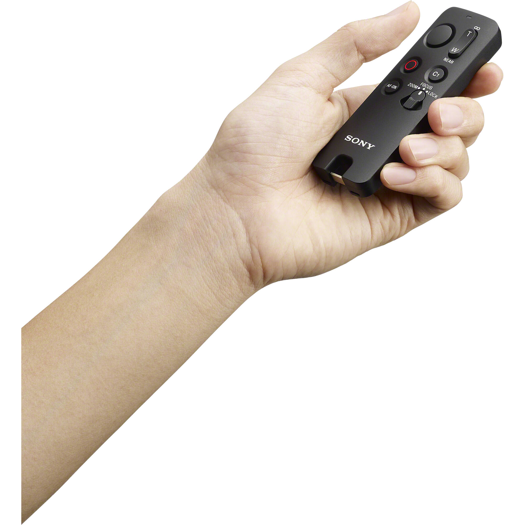 Sony RMT-VP2 wireless remote commander with Bluetooth connectivity, 10m operating range, one-handed control buttons for shutter, movie recording, autofocus, customizable C1 button, zoom/focus rocker, LED status indicator, dust and moisture resistant design, compatible with Sony Alpha cameras and selected Xperia smartphones.