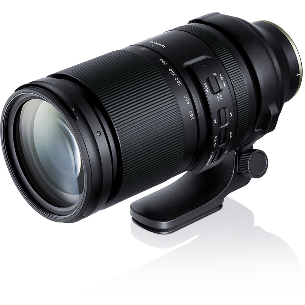 Camera lens with focus ring and control buttons on a white background