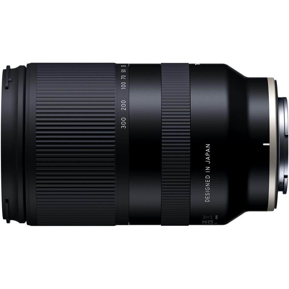 Black Tamron lens with 'Designed in Japan' text on a white background