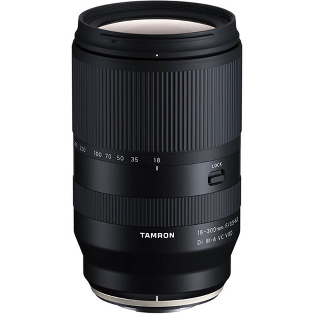 Black camera lens with 'Tamron' branding on a white background
