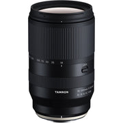 Black camera lens with 'Tamron' branding on a white background