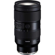 Black camera lens with Tamron branding on a white background