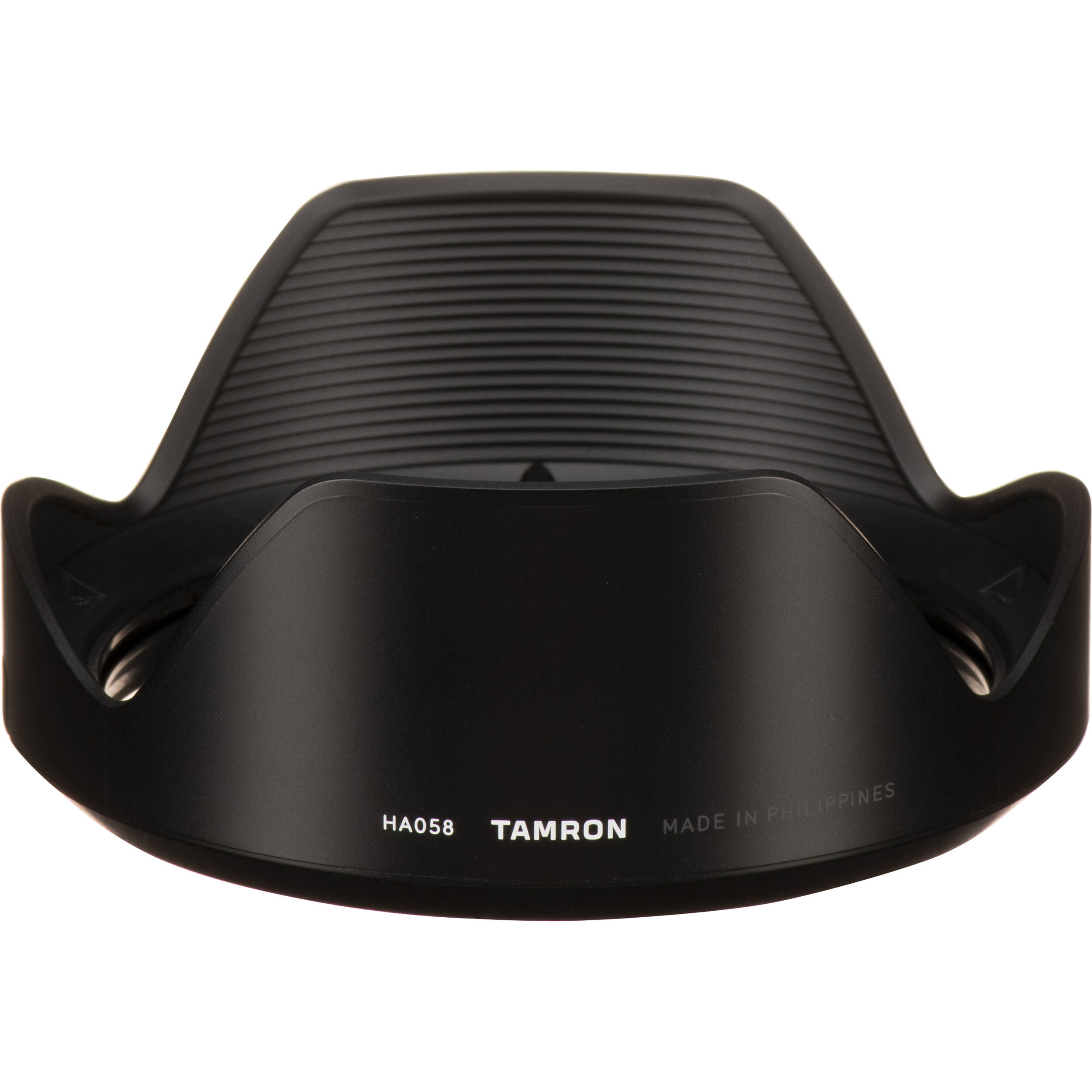 Black camera lens hood with Tamron branding on a white background