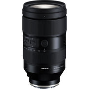 Black camera lens with Tamron branding on a white background