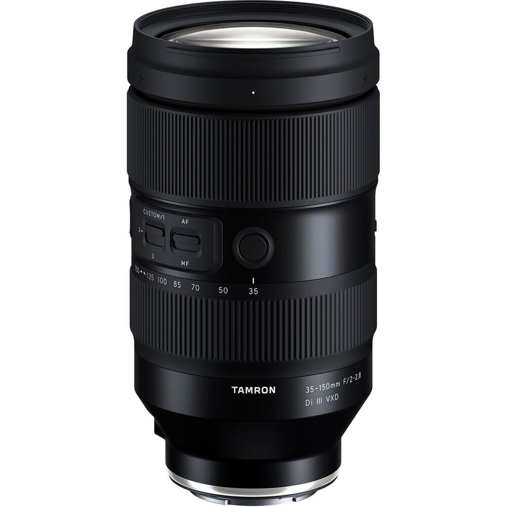 Black camera lens with Tamron branding on a white background