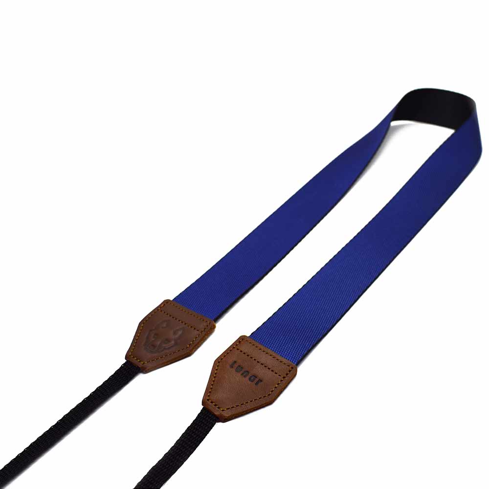 Inspired by the big open skies of Africa, the Lunar Explorer camera strap is perfect for adventurers at heart. Features genuine leather ends. For sale online.