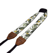 The Lunar Tropical camera strap is inspired by South African flora, featuring its native Strelitzia flower and Monstera. Shop beautiful camera straps online.