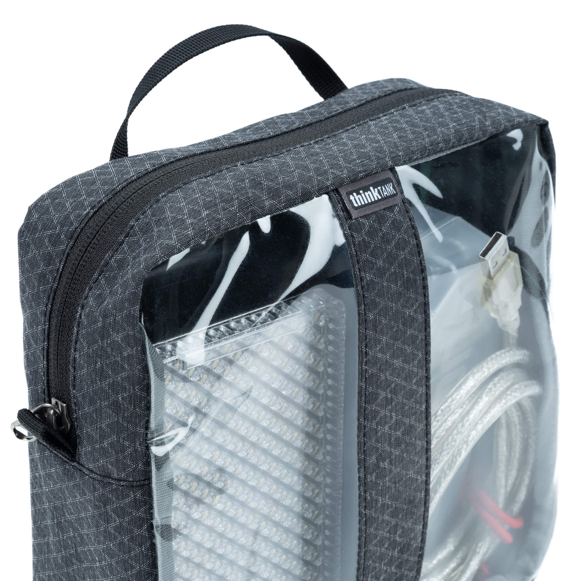 Think Tank Cable Management clear pouch for organising cables with easy visibility.