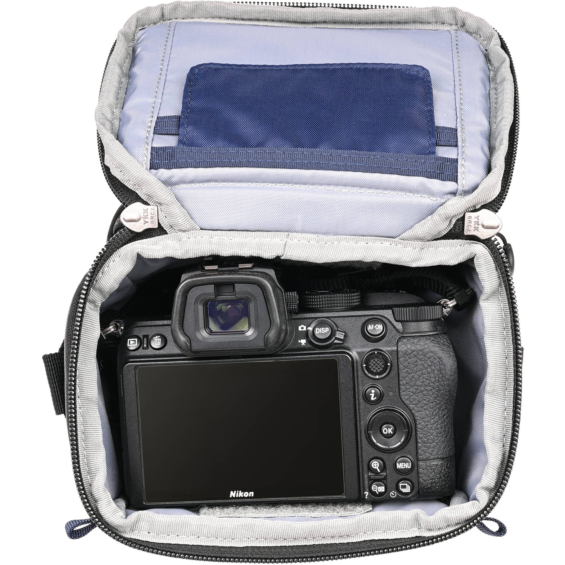 Think Tank mirrorless camera holster with accessory pockets
