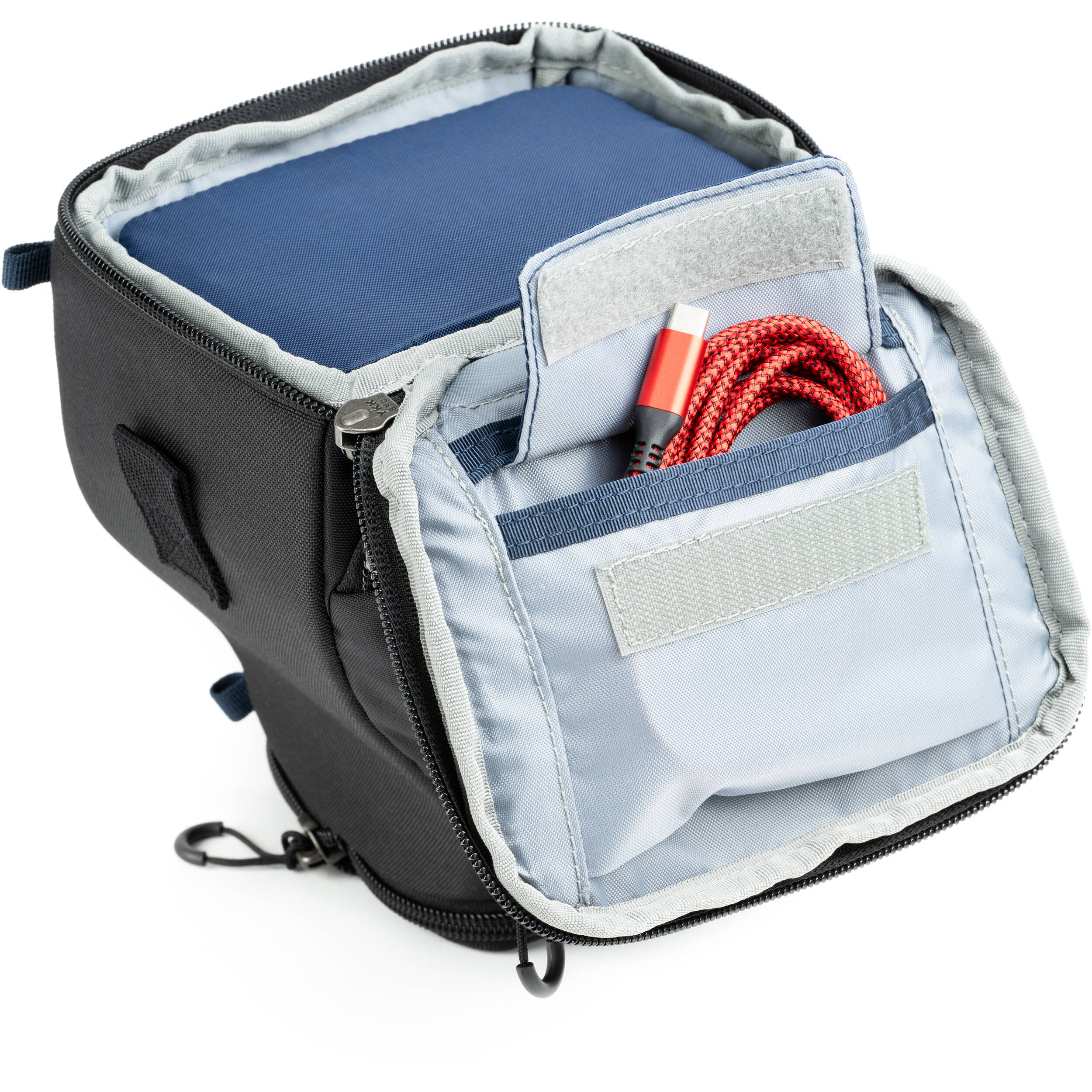 Think Tank mirrorless camera holster with accessory pockets
