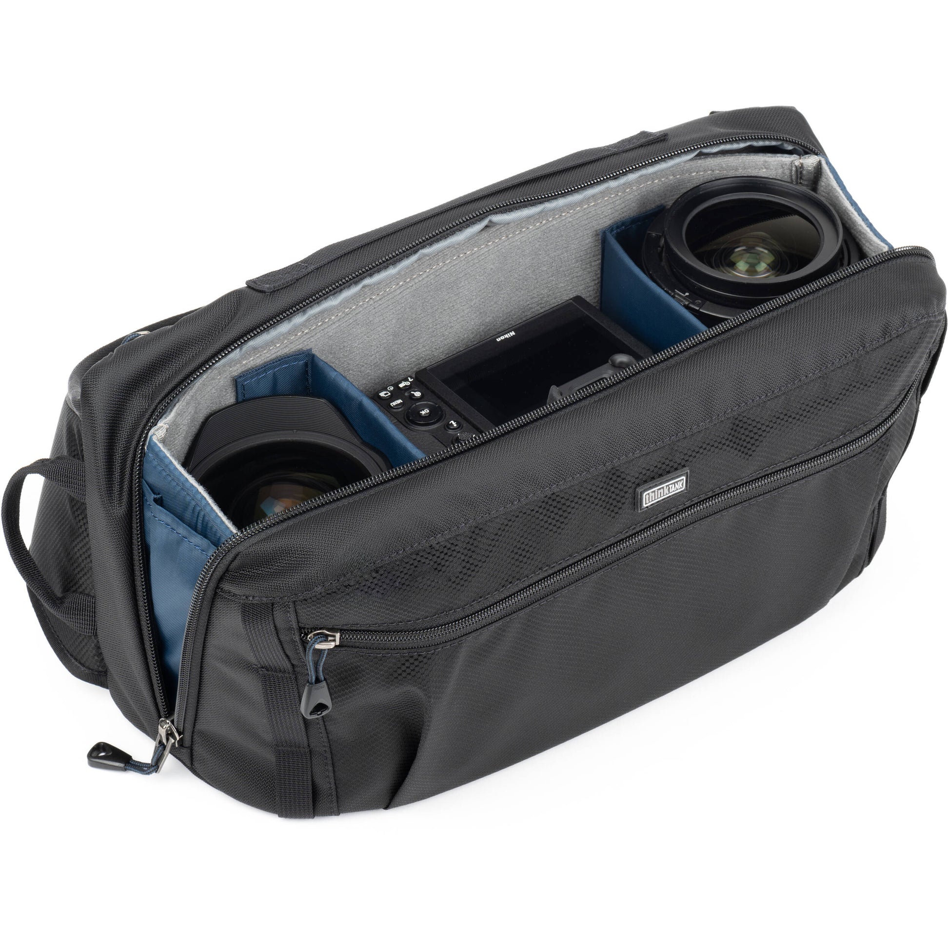 PressPass Sling Bag with removable insert, grab handle, and rain cover for easy camera access.