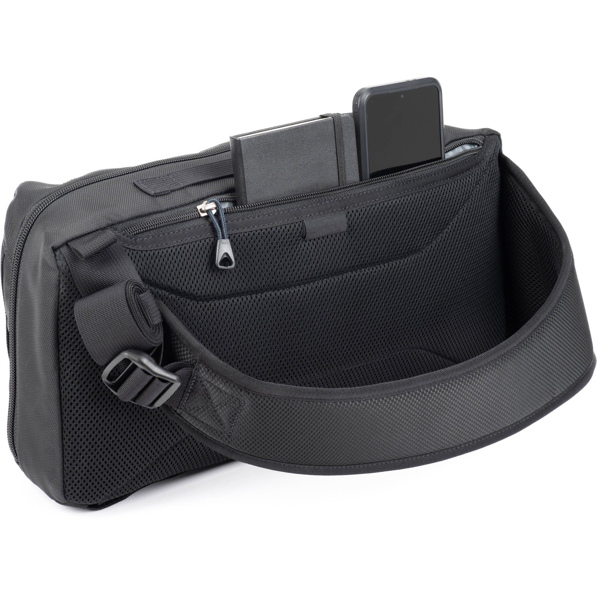 PressPass Sling Bag with removable insert, grab handle, and rain cover for easy camera access.