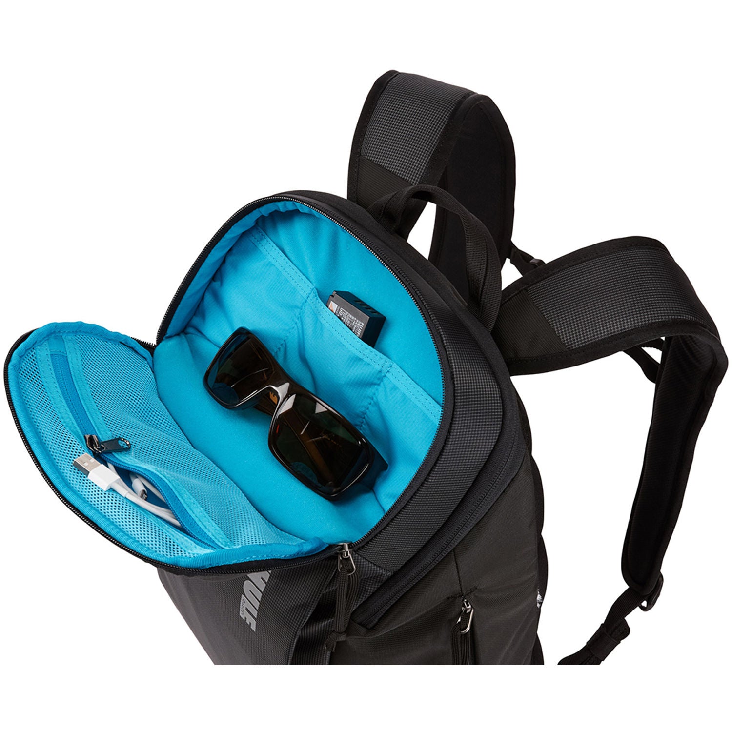 Thule camera backpack with padded compartments, adjustable dividers, and ergonomic straps