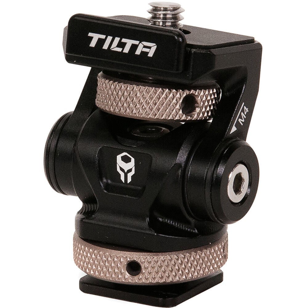 Tilta Adjustable Cold Shoe Bracket in black, made from aluminum and stainless steel, featuring a tension-based tilt adjustment and padded platform for secure mounting of accessories on camera cages or hot shoes.