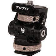 Tilta Adjustable Cold Shoe Bracket in black, made from aluminum and stainless steel, featuring a tension-based tilt adjustment and padded platform for secure mounting of accessories on camera cages or hot shoes.