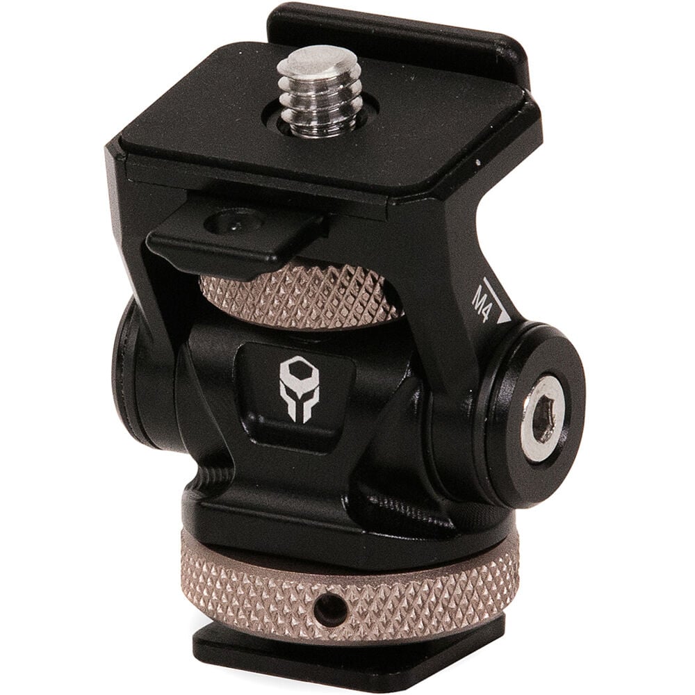 Tilta Adjustable Cold Shoe Bracket in black, made from aluminum and stainless steel, featuring a tension-based tilt adjustment and padded platform for secure mounting of accessories on camera cages or hot shoes.